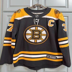 : Fanatics Boston Bruins Patrice Bergeron Home Jersey | Black | Men’s Medium